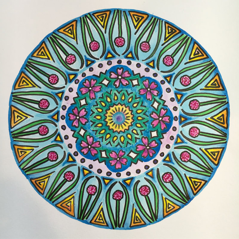 hand drawn pen and ink mandala with flowers